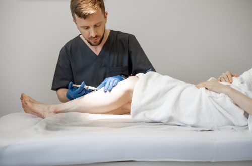 Phlebologist,Makes,Injections,Into,A,Vein,,Performing,Sclerotherapy,On,The